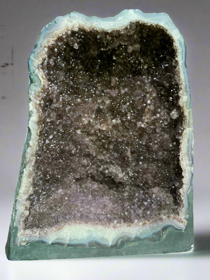 Large Brazilian amethyst cathedral geode with unique natural inclusions.