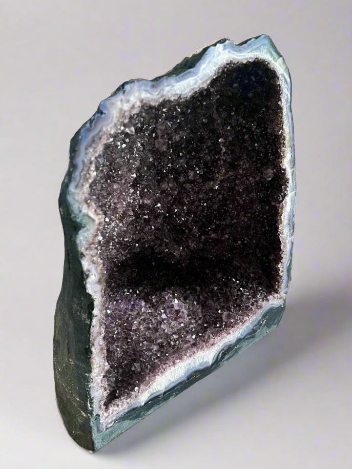 Large Brazilian amethyst cathedral geode with unique natural inclusions.