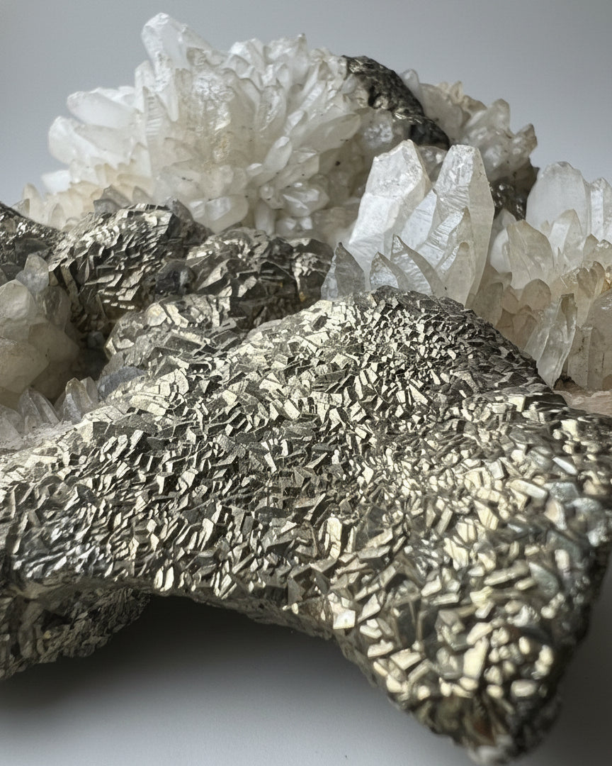 Druzy Cubic Pyrite on Opaque Quartz Cluster. Peru.