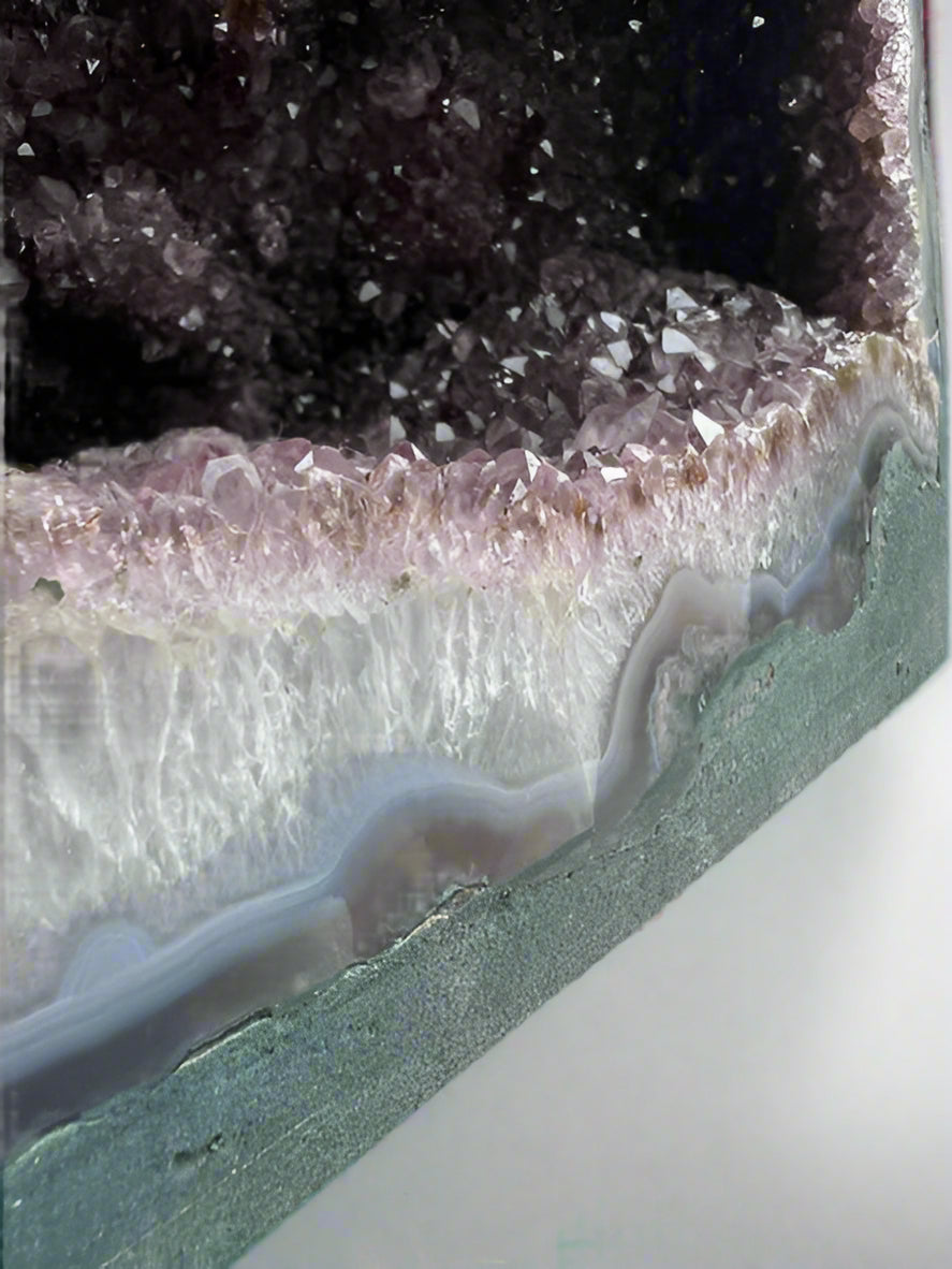 Large Brazilian amethyst cathedral geode with unique natural inclusions.