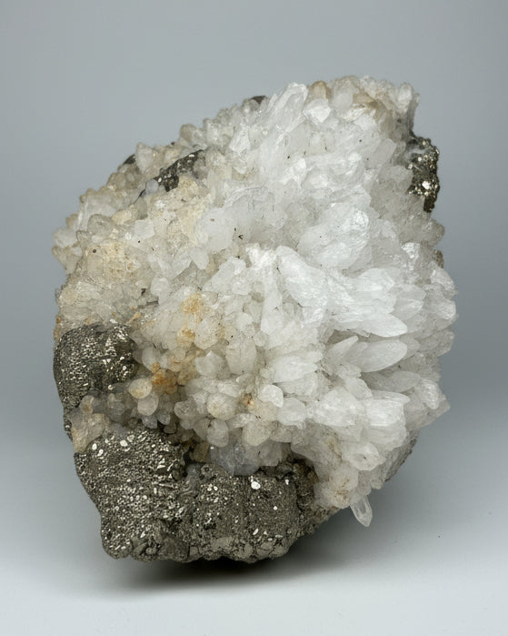 Druzy Cubic Pyrite on Opaque Quartz Cluster. Peru.