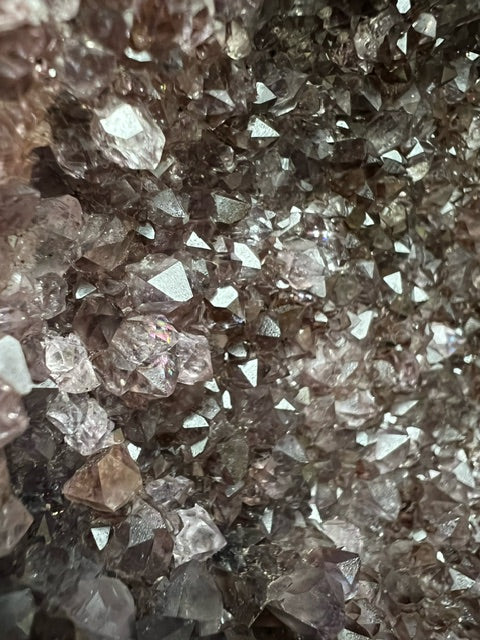 Large Brazilian amethyst cathedral geode with unique natural inclusions.