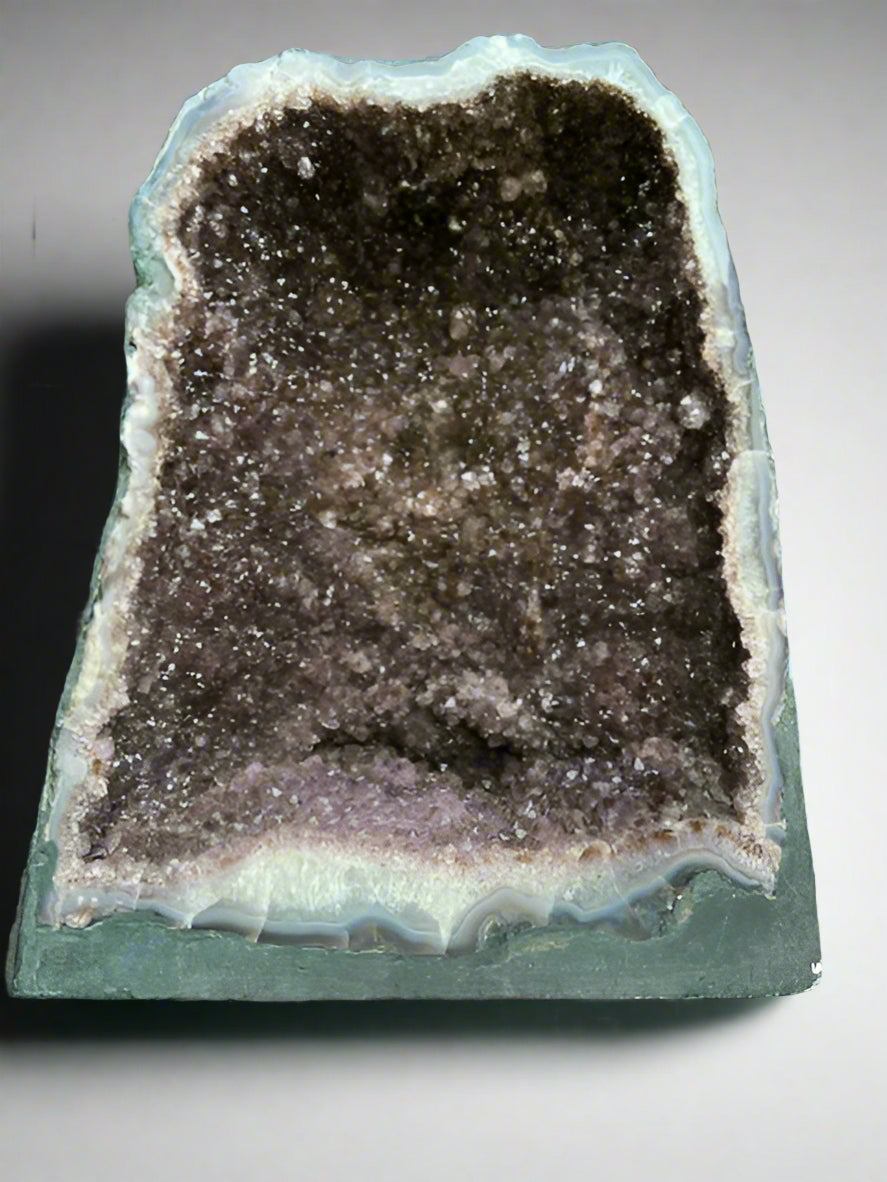 Large Brazilian amethyst cathedral geode with unique natural inclusions.