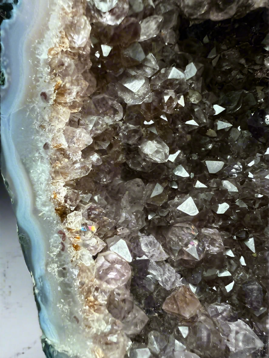 Large Brazilian amethyst cathedral geode with unique natural inclusions.