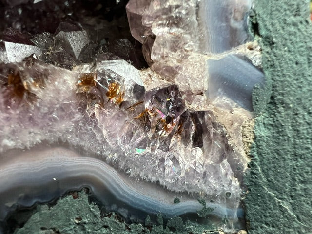 Large Brazilian amethyst cathedral geode with unique natural inclusions.